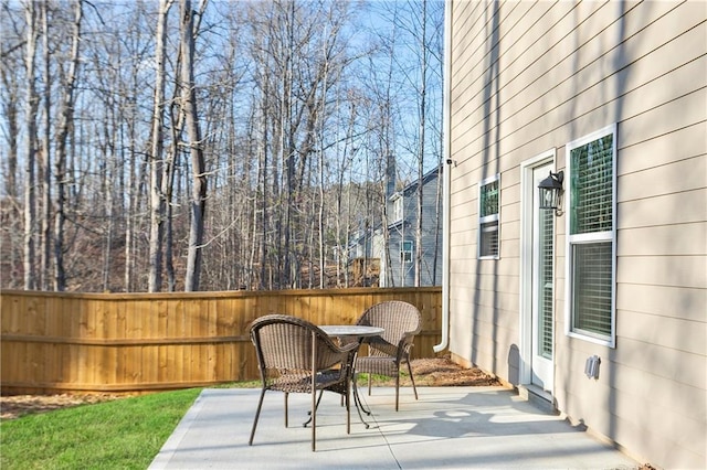 view of patio / terrace featuring fence