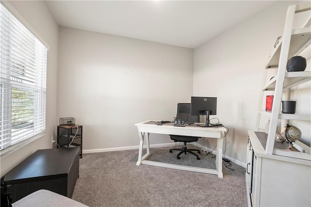 carpeted home office with baseboards