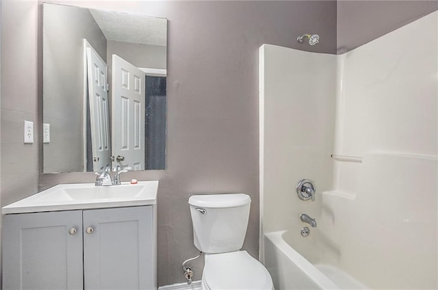 bathroom featuring toilet,  shower combination, and vanity