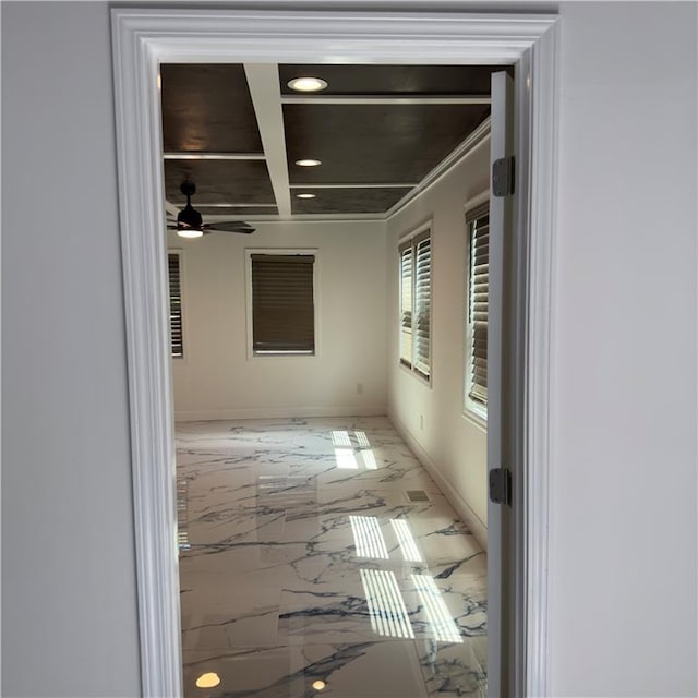 hallway featuring beam ceiling