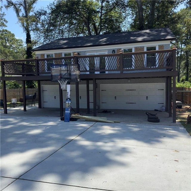 exterior space with a balcony and a garage