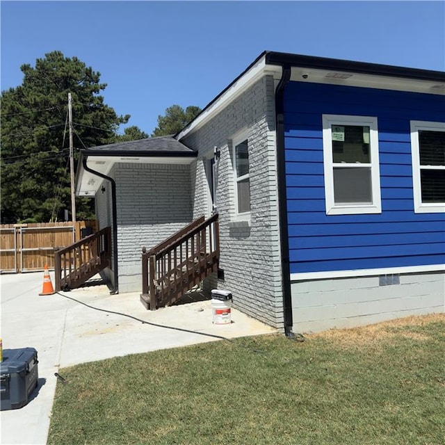 view of property exterior featuring a lawn