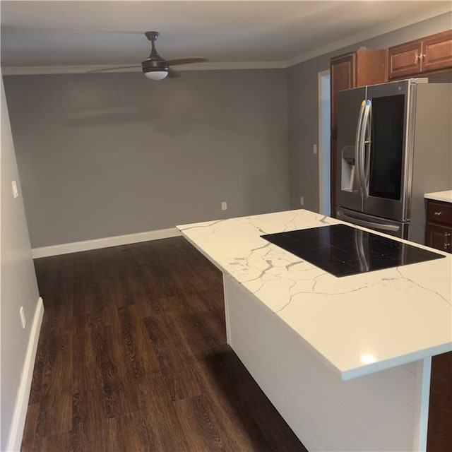 kitchen with dark wood-type flooring, black electric cooktop, stainless steel fridge with ice dispenser, and a center island