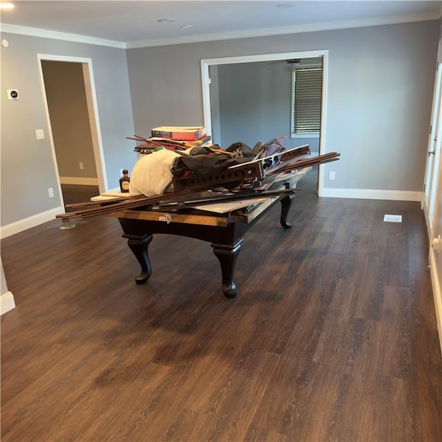 recreation room with crown molding and dark hardwood / wood-style flooring