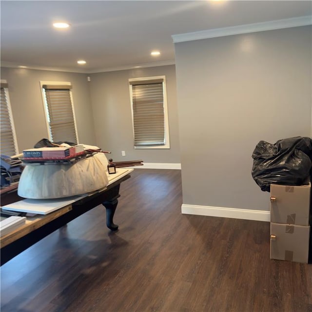 playroom with ornamental molding and dark hardwood / wood-style flooring