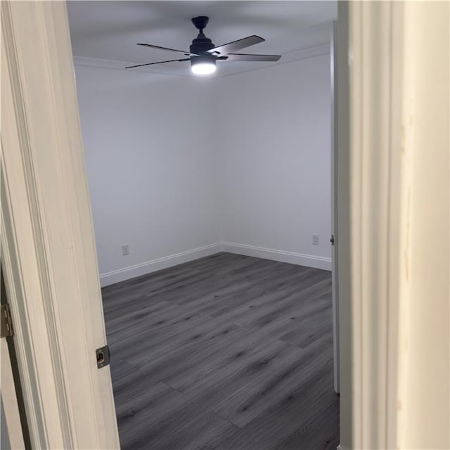 unfurnished room featuring crown molding, ceiling fan, and dark hardwood / wood-style floors