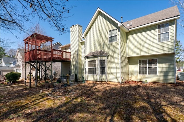 back of house with a wooden deck