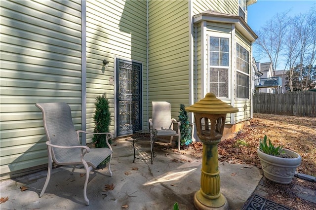 view of patio featuring fence