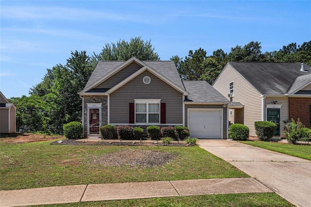 855 Lakeside Cir, Covington, GA 30016 - view of front of property with concrete driveway, an attached garage, and a front yard
