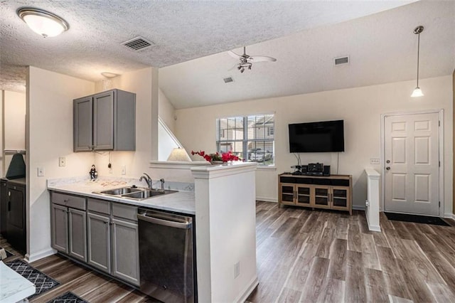 855 Lakeside Cir, Covington, GA 30016 - kitchen featuring dishwasher, a sink, gray cabinets, dark wood-style flooring, and a textured ceiling