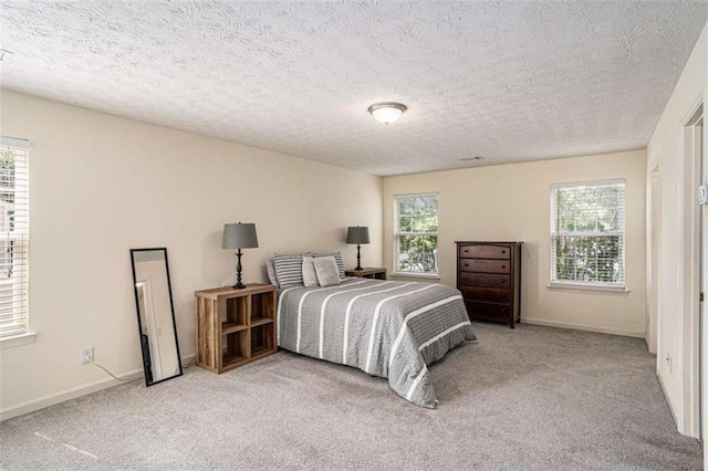 855 Lakeside Cir, Covington, GA 30016 - carpeted bedroom with baseboards and a textured ceiling