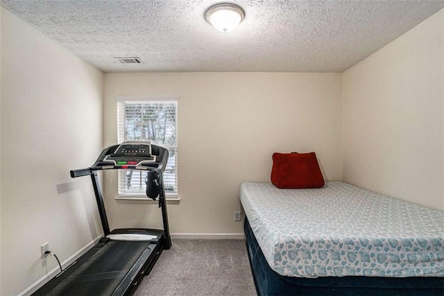 855 Lakeside Cir, Covington, GA 30016 - bedroom with carpet floors, a textured ceiling, and baseboards