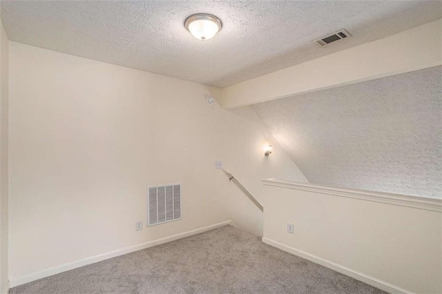 855 Lakeside Cir, Covington, GA 30016 - unfurnished room with a textured ceiling, carpet floors, and baseboards
