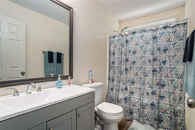 855 Lakeside Cir, Covington, GA 30016 - bathroom with vanity, toilet, and curtained shower