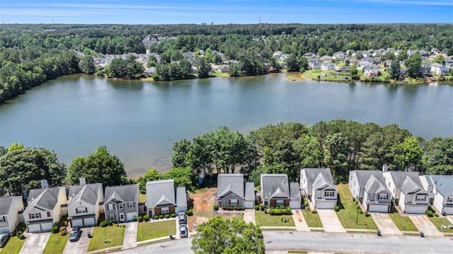 855 Lakeside Cir, Covington, GA 30016 - aerial perspective of suburban area with a nearby body of water and a forest