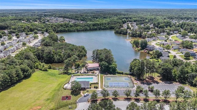 855 Lakeside Cir, Covington, GA 30016 - aerial view of a forest, a nearby body of water, and a pool area