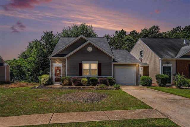 855 Lakeside Cir, Covington, GA 30016 - view of front of house with driveway, a garage, and a lawn