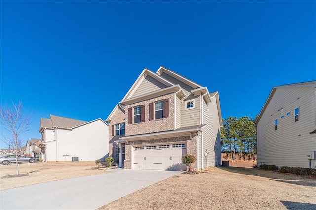 view of front of home featuring an attached garage, brick siding, and driveway