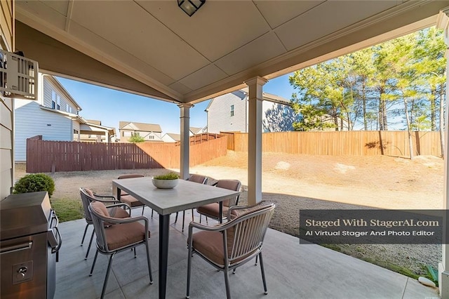 view of patio / terrace with a fenced backyard and outdoor dining space