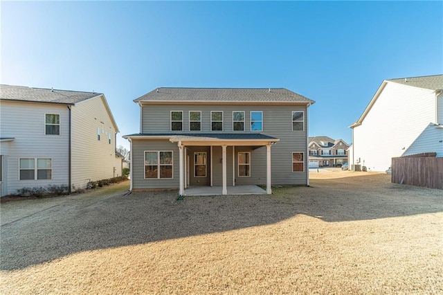 back of house with a patio