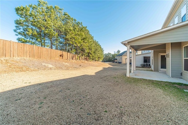 view of yard featuring a patio area and fence