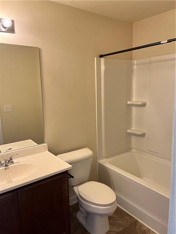 bathroom featuring toilet, tile patterned floors, vanity, and  shower combination