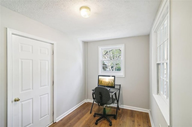 office featuring a textured ceiling and dark hardwood / wood-style floors