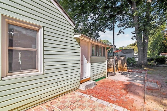 view of side of property featuring a patio area