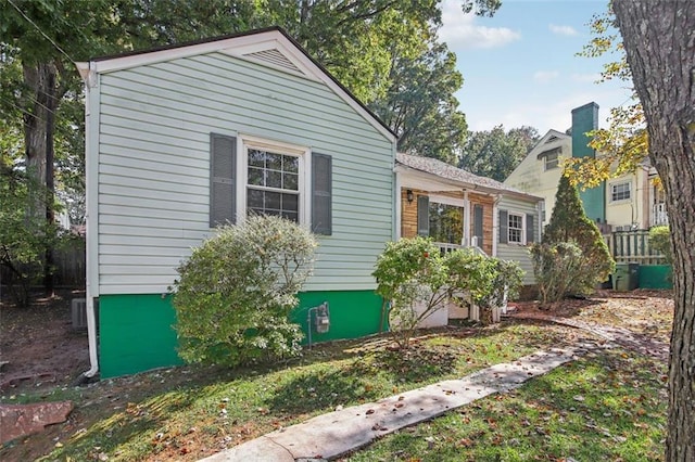 view of property exterior with central AC unit