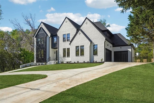 view of front of house with a front yard and a garage