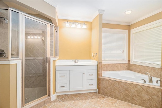 bathroom with a garden tub, ornamental molding, a stall shower, and a sink