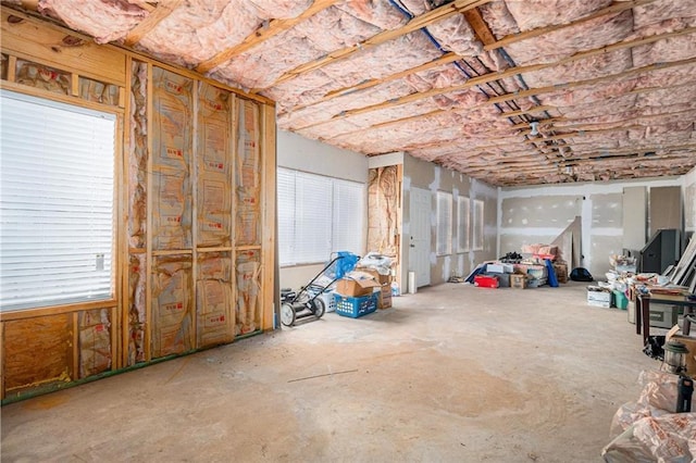 misc room with unfinished concrete flooring