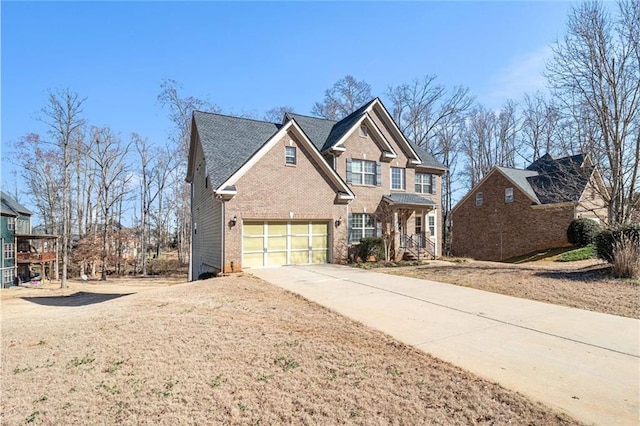 view of front of property featuring brick siding and driveway