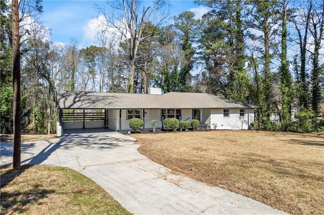 single story home with driveway, an attached carport, and a front yard