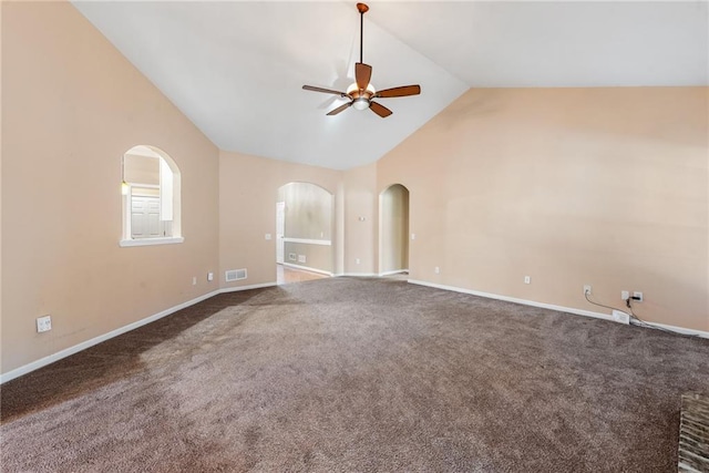 spare room with high vaulted ceiling, ceiling fan, and carpet flooring