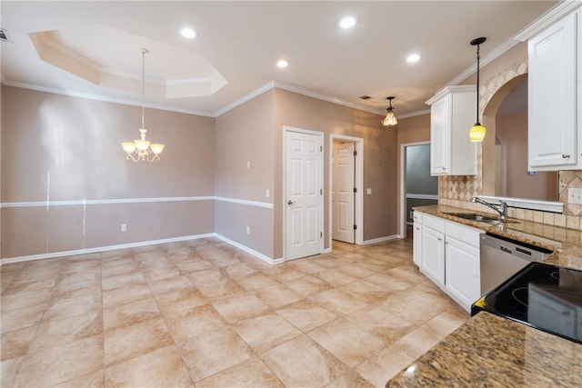 kitchen with pendant lighting, sink, white cabinets, and stone countertops