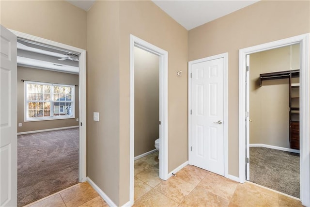 interior space featuring toilet and tile patterned flooring