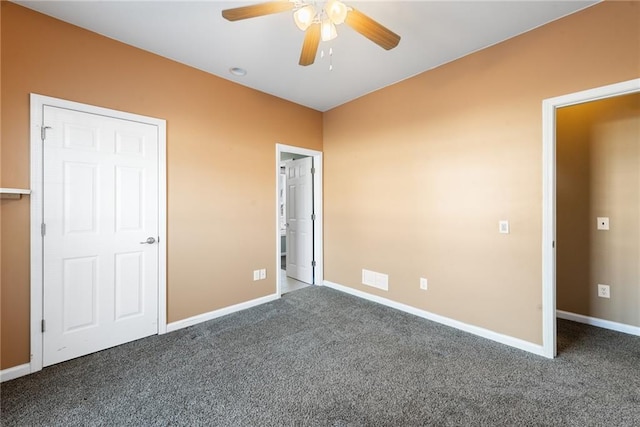 unfurnished bedroom with ceiling fan and carpet