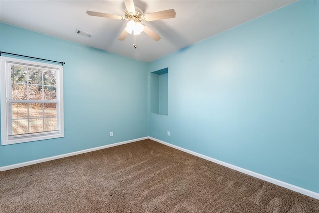 carpeted empty room with ceiling fan