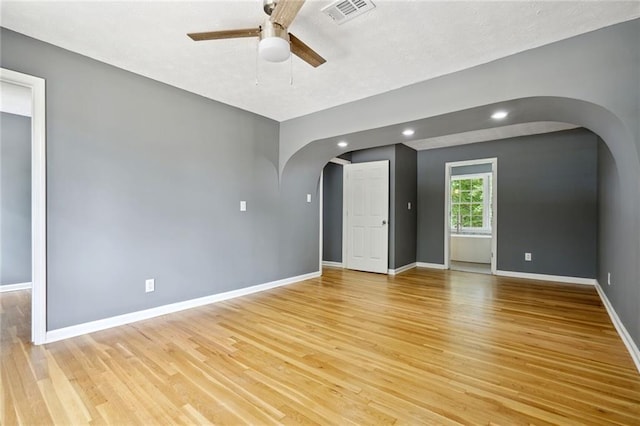 spare room with ceiling fan and light hardwood / wood-style flooring