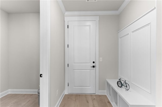 mudroom featuring crown molding and light hardwood / wood-style flooring