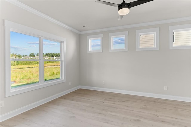 spare room with light hardwood / wood-style flooring, ceiling fan, and crown molding