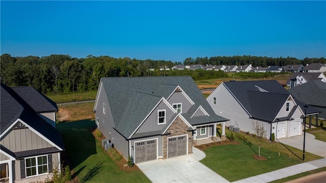 view of front facade with a front yard and a garage