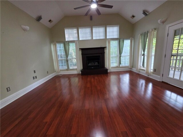 200 Valley Brook Dr, Newnan, GA 30265 - unfurnished living room with ceiling fan, a fireplace with raised hearth, wood finished floors, high vaulted ceiling, and baseboards