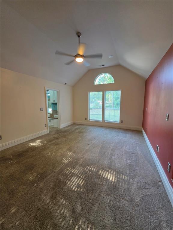 200 Valley Brook Dr, Newnan, GA 30265 - carpeted spare room with ceiling fan, lofted ceiling, and baseboards