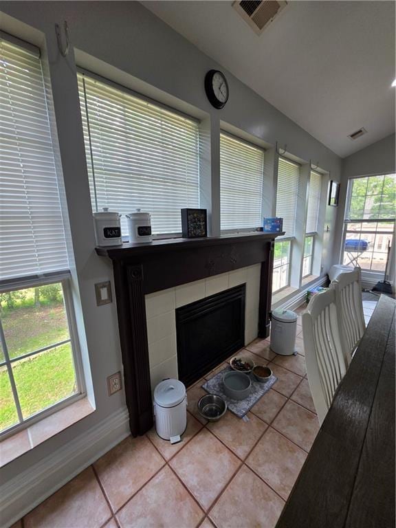 details with a fireplace, visible vents, and baseboards
