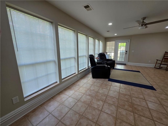 living area with recessed lighting, light tile patterned floors, a ceiling fan, visible vents, and baseboards