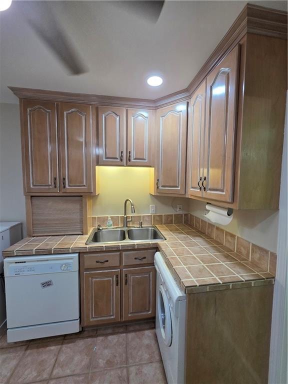 interior space featuring a sink, laundry area, and washer / clothes dryer