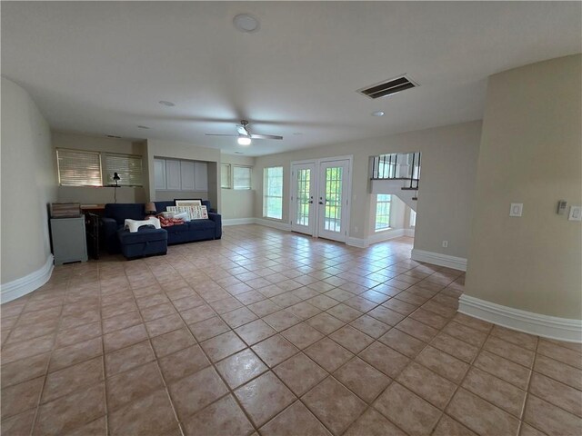 200 Valley Brook Dr, Newnan, GA 30265 - living room featuring a ceiling fan, light tile patterned floors, and baseboards