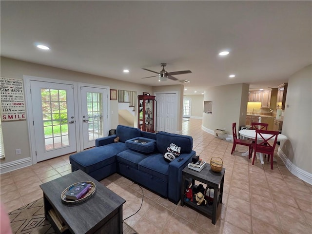 living room with recessed lighting, light tile patterned floors, ceiling fan, baseboards, and french doors